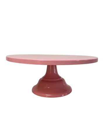 Pink cake stand on a white background