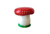 Mushroom-shaped object with a red polka dot cap on a white background
