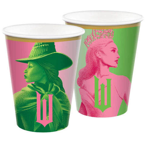 Two paper cups with artistic designs of glinda and Elphaba wearing hats on a white background