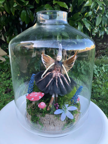 glass jar and fairy for table decoration