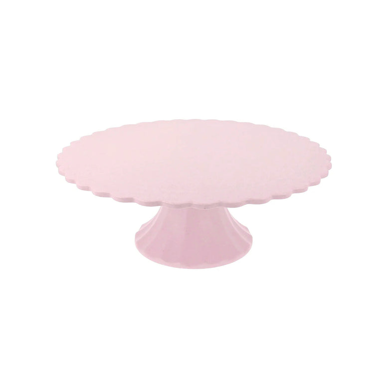 Pink cake stand on a white background