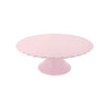 Pink cake stand on a white background