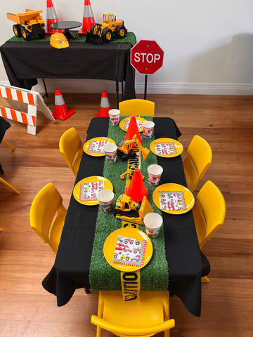 Yellow chairs and tables construction party theme 